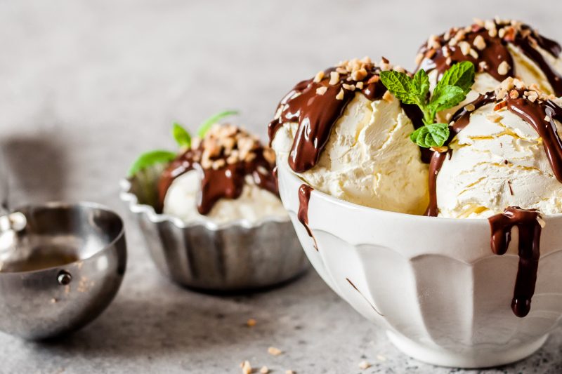 Vanilla Ice Cream Scoops with Chocolate Ganache and Chopped Nut Topping, banner