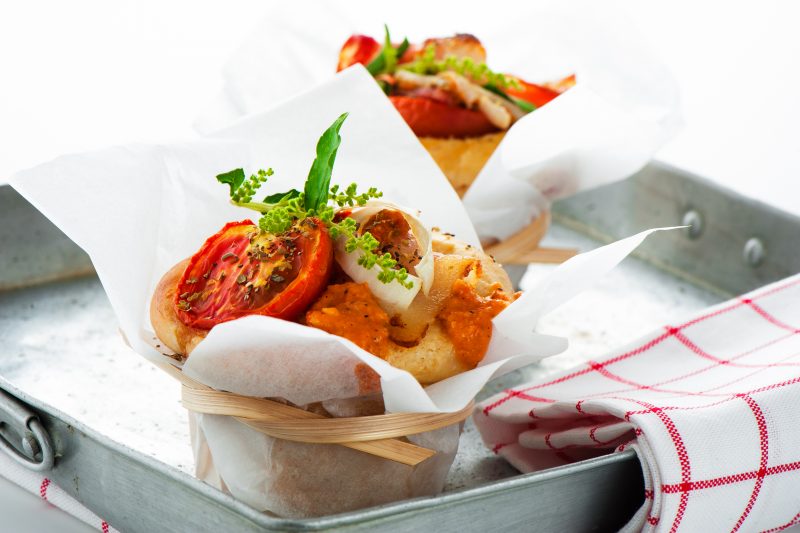 Fresh pizza muffin as a snack on white background as a studio shot