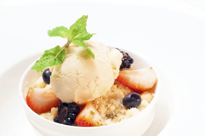 gourmet Apple crumble with icecream dessert on white background