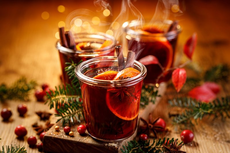 Christmas mulled red wine with aromatic spices and citrus fruits