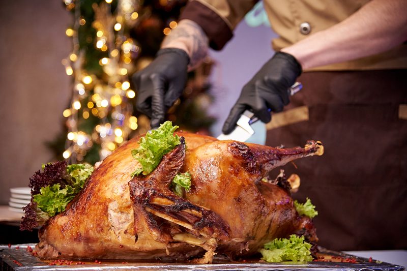 Appetizing baked turkey on a tray in a restaurant.