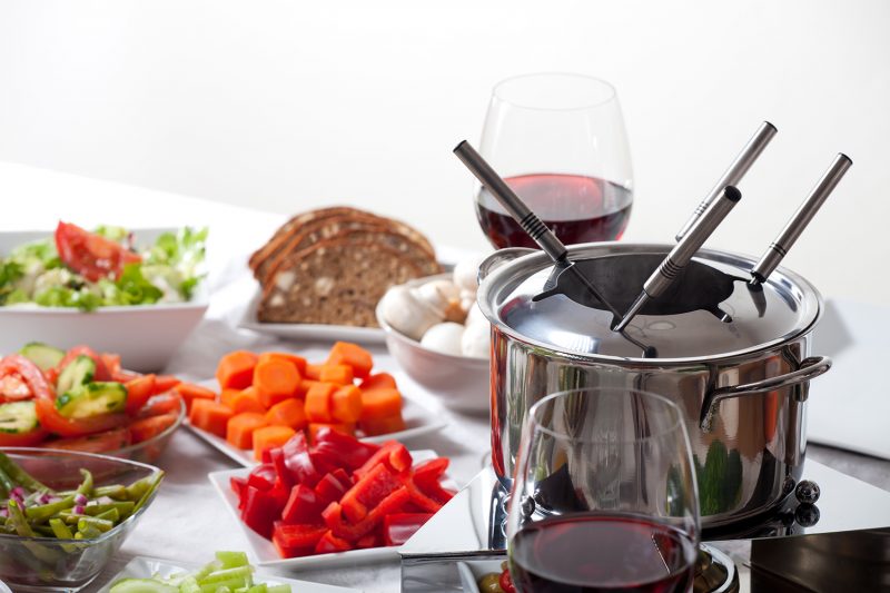 table with fondue set and ingredients